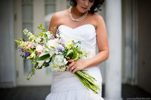 bride with long stemmed bouquet.