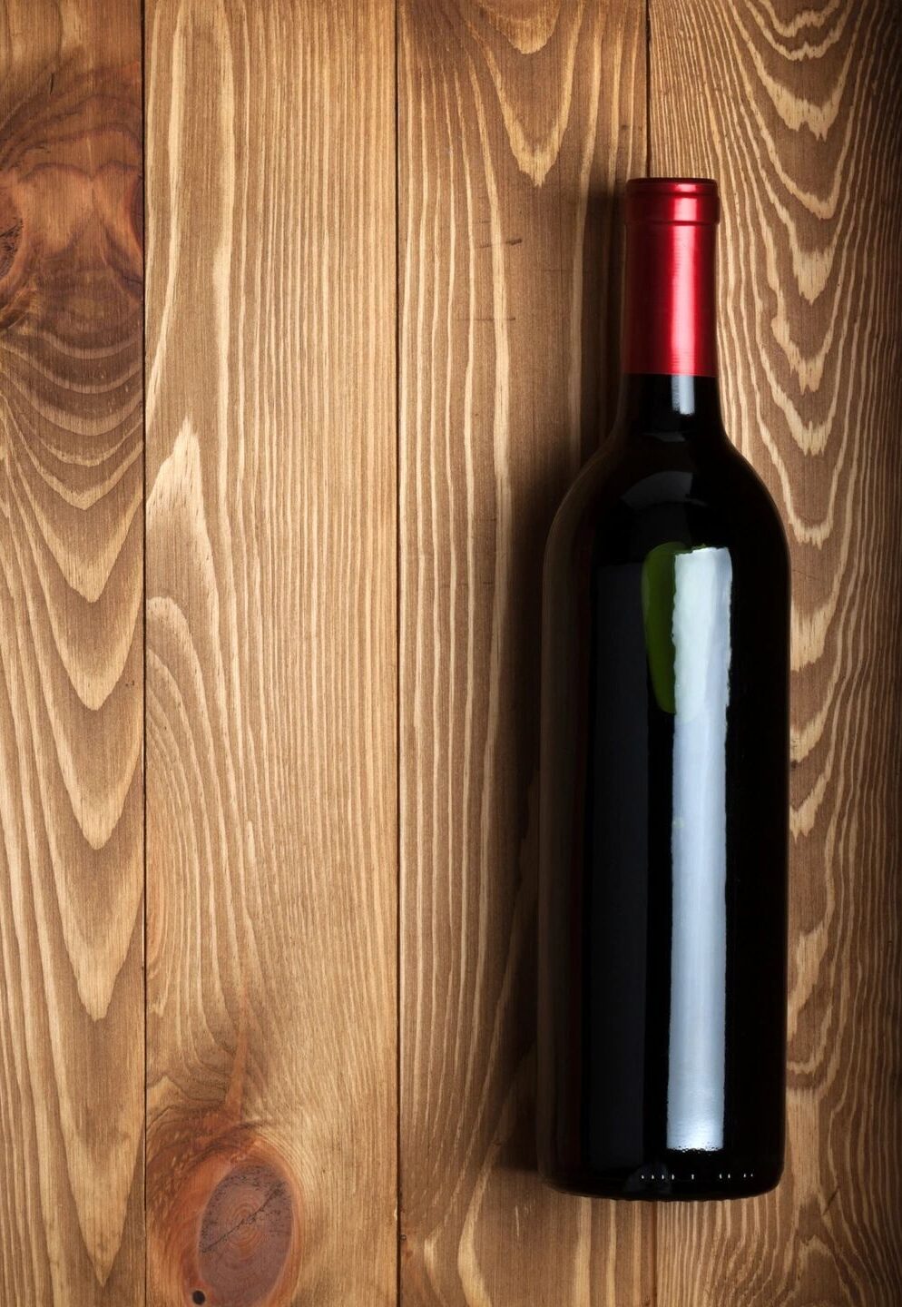 product photography of wine bottle on wooden background.