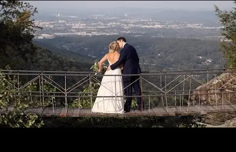 couple kissing on bridge in Rock City Chattanooga Tennessee